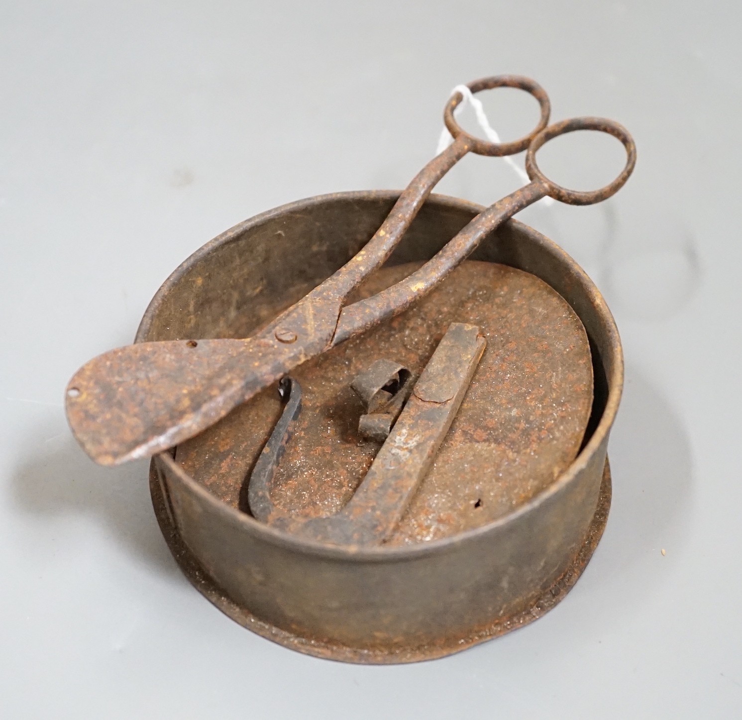 A 19th century tinder box, flint and strike and a pair of wick cutters